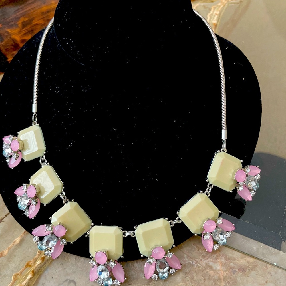 Necklace with pink and clear crystal bees.